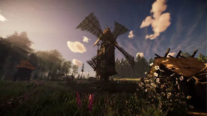 A windmill beside farm buildings in ASKA